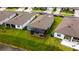 Aerial view of a screened-in lanai in the backyard of a home in a modern community at 9263 Barrier Coast Trl, Parrish, FL 34219