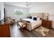 Serene bedroom with ample natural light and cozy furnishings at 9263 Barrier Coast Trl, Parrish, FL 34219