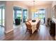 Bright dining area with views of the screened lanai and lake at 9263 Barrier Coast Trl, Parrish, FL 34219