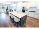 Bright, open-concept kitchen with a large island and seating, perfect for entertaining guests at 9263 Barrier Coast Trl, Parrish, FL 34219