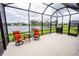 Outdoor patio with a scenic view, grilling area and comfortable seating at 9263 Barrier Coast Trl, Parrish, FL 34219