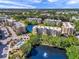 Aerial view of the community buildings, lake and pool at 960 Starkey Rd # 1503, Largo, FL 33771