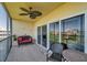 Relaxing balcony with comfortable seating, stylish ceiling fan and sliding glass doors to the inside at 960 Starkey Rd # 1503, Largo, FL 33771