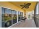 An outdoor balcony with stylish ceiling fan and chairs at 960 Starkey Rd # 1503, Largo, FL 33771