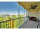 Enjoy serene views from this screened balcony with comfortable seating and a ceiling fan at 960 Starkey Rd # 1503, Largo, FL 33771
