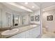 Bathroom featuring double sinks, shower with glass door, and granite countertops at 960 Starkey Rd # 1503, Largo, FL 33771