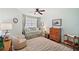 Light and airy bedroom with daybed, decorative pillows, chair, and dresser at 960 Starkey Rd # 1503, Largo, FL 33771