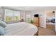 Inviting bedroom with wood trim, large windows, and a view of the community at 960 Starkey Rd # 1503, Largo, FL 33771