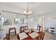 Dining room featuring views of the kitchen, breakfast bar and the community beyond at 960 Starkey Rd # 1503, Largo, FL 33771