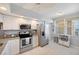 Well-equipped kitchen with stainless steel appliances, granite countertops, and ample storage at 960 Starkey Rd # 1503, Largo, FL 33771