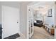 View from foyer looking into a living room with a sofa and bench at 960 Starkey Rd # 1503, Largo, FL 33771