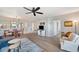 Comfortable open-concept living room showcasing laminate floors and neutral paint palette at 960 Starkey Rd # 1503, Largo, FL 33771