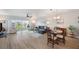Spacious living room and dining area with stylish furnishings and balcony access at 960 Starkey Rd # 1503, Largo, FL 33771
