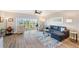 Open living space featuring modern furnishings, lots of natural light, and views of the community at 960 Starkey Rd # 1503, Largo, FL 33771