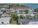 This aerial view shows a well-situated property near ample parking and the waterfront at 10562 Lake Dr, Seminole, FL 33772