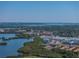 Scenic aerial view of waterfront community with lush greenery and stunning water views at 10562 Lake Dr, Seminole, FL 33772