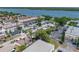 Aerial view of a neighborhood with waterfront access featuring a mix of residential and commercial properties at 10562 Lake Dr, Seminole, FL 33772