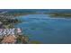 Panoramic aerial view of a lakefront community with homes and condos, offering a waterfront lifestyle at 10562 Lake Dr, Seminole, FL 33772