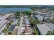 Aerial view of home surrounded by neighborhood and roadways at 10562 Lake Dr, Seminole, FL 33772