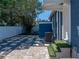 Backyard featuring a paved patio, stone pavers, a privacy fence, and comfortable seating, perfect for relaxing at 10562 Lake Dr, Seminole, FL 33772