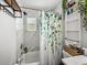 Nicely-updated bathroom features a tub and shower combination and decorative wall accents at 10562 Lake Dr, Seminole, FL 33772