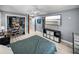 Bright bedroom with a large closet and wood-look luxury vinyl flooring at 10562 Lake Dr, Seminole, FL 33772