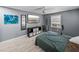 Nicely-appointed bedroom featuring stylish decor, and wood-look luxury vinyl flooring at 10562 Lake Dr, Seminole, FL 33772