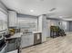 Bright kitchen features white cabinets, stainless steel appliances, and modern countertops at 10562 Lake Dr, Seminole, FL 33772