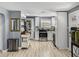 Bright, white kitchen with stainless steel appliances, updated countertops, and plenty of storage, creating a functional and stylish space at 10562 Lake Dr, Seminole, FL 33772