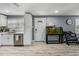 Bright kitchen features white cabinets, stainless steel appliances, and modern countertops, offering a clean and stylish cooking space at 10562 Lake Dr, Seminole, FL 33772