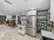 Bright open kitchen features modern stainless steel appliances, ample storage, and easy access to adjacent living area at 10562 Lake Dr, Seminole, FL 33772