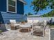 Back patio featuring an outdoor seating area with modern patio furniture at 10562 Lake Dr, Seminole, FL 33772