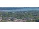 A striking view of the ocean and city skyline beyond a green landscape at 10562 Lake Dr, Seminole, FL 33772