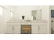 Bright bathroom with double vanity, granite countertop, and stylish fixtures at 10824 Keato Beach Ct, Tampa, FL 33647