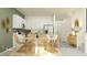 Bright and airy kitchen with white cabinets, stainless steel appliances, and dining area at 10824 Keato Beach Ct, Tampa, FL 33647