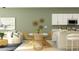 Cozy living room with dining area featuring modern decor, comfortable seating, and natural light at 10824 Keato Beach Ct, Tampa, FL 33647