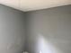 Plain gray bedroom offering neutral walls and a fan at 1106 Woodlawn Ave, Plant City, FL 33563