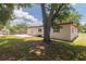 Secluded backyard featuring mature trees, a concrete patio, and a serene outdoor space at 11210 Wheeling Dr, Tampa, FL 33625