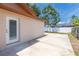 Spacious backyard featuring a concrete patio and privacy fence, perfect for outdoor entertaining at 11210 Wheeling Dr, Tampa, FL 33625