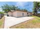 Expansive backyard with a concrete patio, perfect for outdoor activities and relaxation at 11210 Wheeling Dr, Tampa, FL 33625