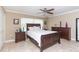 Bedroom showcasing a wooden bed frame, neutral wall colors, and a window, providing a calming and inviting atmosphere at 11210 Wheeling Dr, Tampa, FL 33625