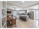 Open-concept kitchen featuring a dining area, central island with stool seating, and stainless steel appliances at 11210 Wheeling Dr, Tampa, FL 33625