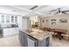 Bright kitchen featuring modern appliances, a center island, and a dining table at 11210 Wheeling Dr, Tampa, FL 33625