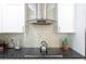 Modern kitchen with stainless steel appliances and stylish range hood at 11210 Wheeling Dr, Tampa, FL 33625