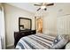 Bedroom with dresser, ceiling fan, and ensuite bathroom at 1231 Godavari Way # 103, Wesley Chapel, FL 33543