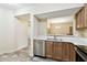 Kitchen with stainless steel appliances and an open view to the dining area at 1231 Godavari Way # 103, Wesley Chapel, FL 33543