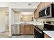 Well-equipped kitchen with stainless steel appliances and seamless access to other living spaces at 1231 Godavari Way # 103, Wesley Chapel, FL 33543