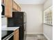 Stylish kitchen highlighting modern appliances and a unique glass block window at 1231 Godavari Way # 103, Wesley Chapel, FL 33543