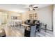 Open living space with contemporary decor, natural lighting, and dining area at 1231 Godavari Way # 103, Wesley Chapel, FL 33543