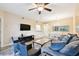The inviting living space has modern furnishings, natural light, and a dining area at 1231 Godavari Way # 103, Wesley Chapel, FL 33543